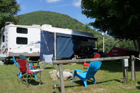 Travel trailer with lawn chairs